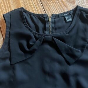 Black silky tank with bow detail around neck